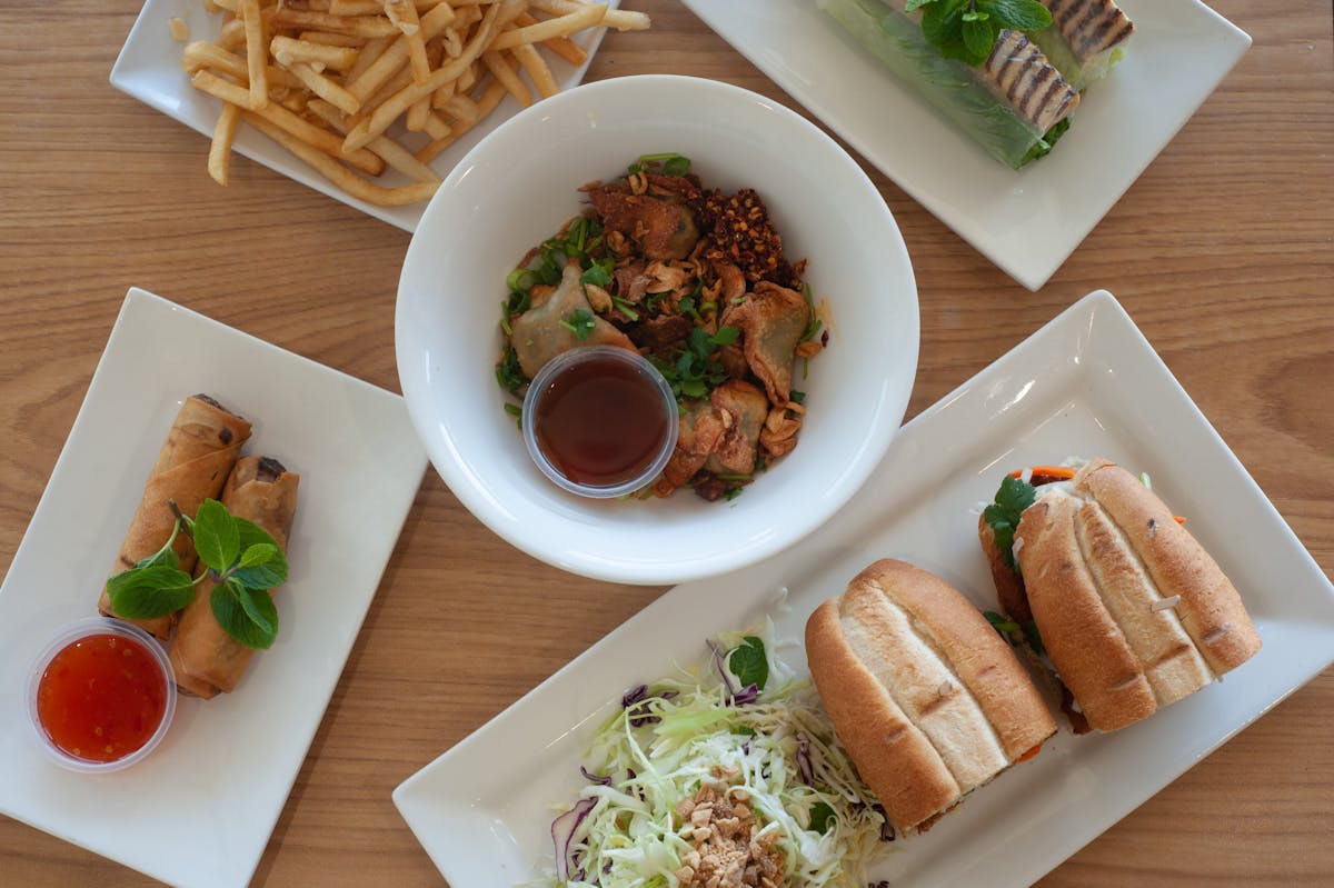 a plate of food sitting on top of a wooden table